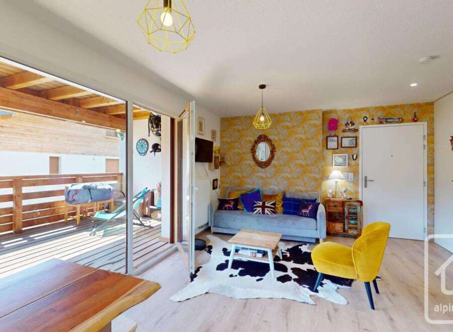 Discover this charming property featuring a cozy living area with stylish decor and a comfortable sofa.