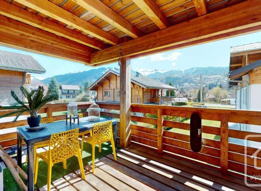 Enjoy breathtaking mountain views from this charming balcony.