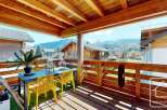 Enjoy breathtaking mountain views from this charming balcony.