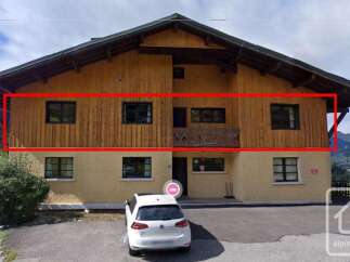 Discover this charming property featuring a stunning wooden facade and a welcoming balcony.