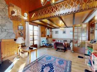 Discover the charm of this cozy property, featuring a stunning stone fireplace and warm wooden accents throughout.