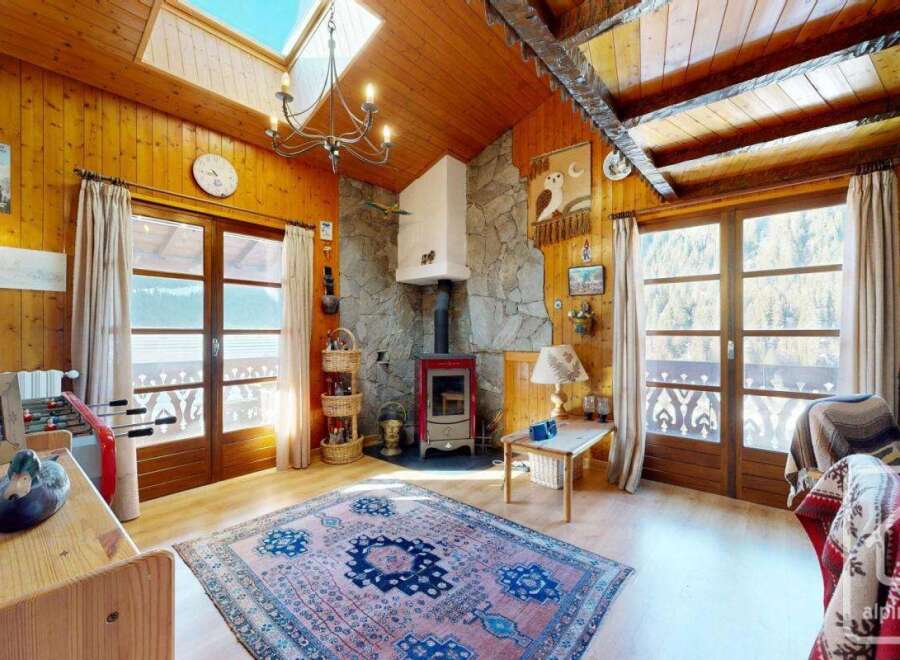 Step into this charming chalet and experience the warmth of its wooden interiors.