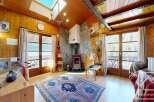 Step into this charming chalet and experience the warmth of its wooden interiors.