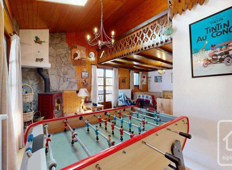 This charming property boasts a cozy interior with a rustic aesthetic, perfect for a relaxing getaway.