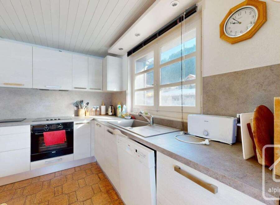 Discover the charm of this stunning kitchen, featuring modern appliances and ample counter space.