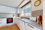 Discover the charm of this stunning kitchen, featuring modern appliances and ample counter space.