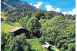 Nestled in a serene mountain landscape, this property offers a unique blend of natural beauty and rustic charm.