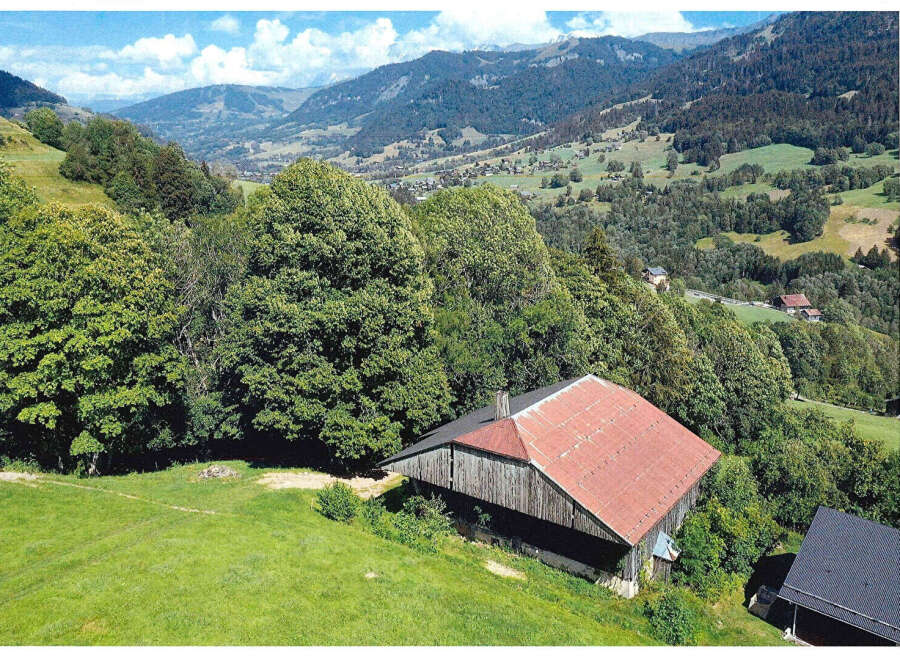Nestled in a picturesque mountain landscape, this charming property offers a tranquil retreat.