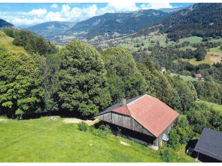 Nestled in a picturesque mountain landscape, this charming property offers a tranquil retreat.