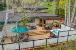 Experience luxury living in this stunning property featuring a spacious deck, perfect for entertaining or relaxing.