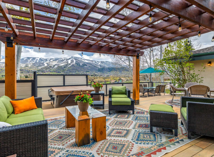 Enjoy the stunning mountain views from this luxurious outdoor living space.