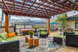 Enjoy the stunning mountain views from this luxurious outdoor living space.
