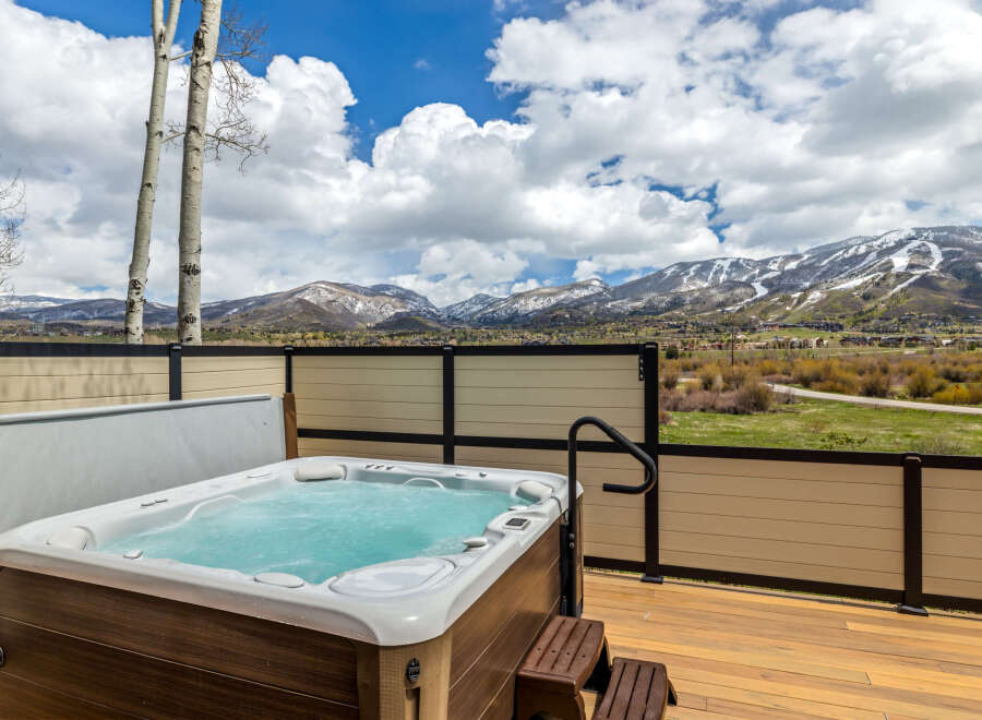 Enjoy breathtaking mountain views from this luxurious property featuring a private hot tub.