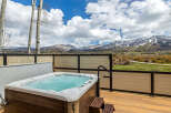 Enjoy breathtaking mountain views from this luxurious property featuring a private hot tub.