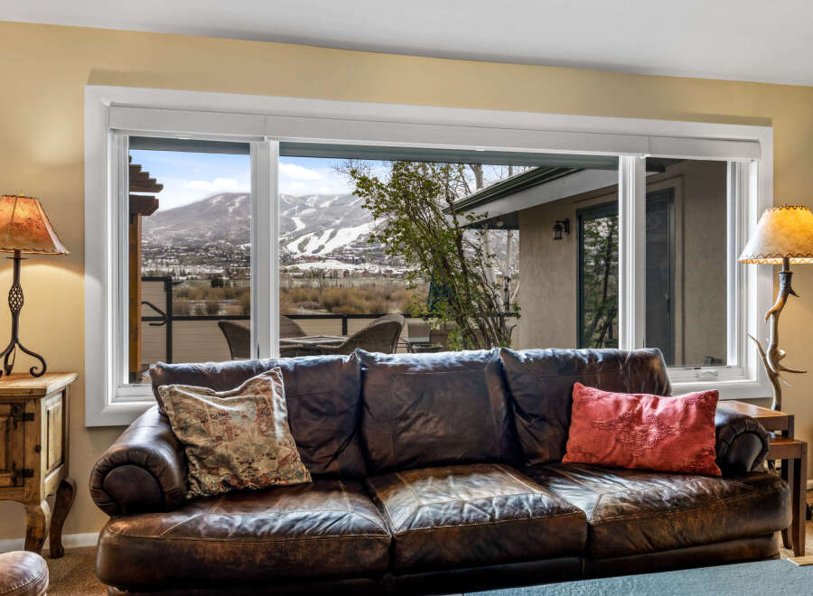 Enjoy breathtaking mountain views from the comfort of this luxurious living room.