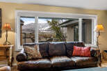 Enjoy breathtaking mountain views from the comfort of this luxurious living room.