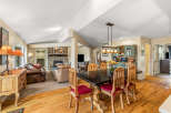 Step into this inviting home featuring a cozy living area with a fireplace and a spacious dining area.