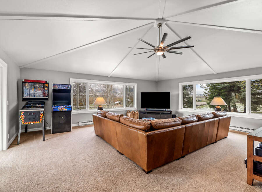 This stunning living room boasts a spacious layout, perfect for entertaining or relaxing.