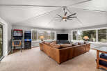 This stunning living room boasts a spacious layout, perfect for entertaining or relaxing.
