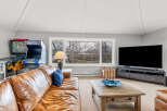 This stunning property boasts a spacious living area, perfect for relaxation and entertainment.