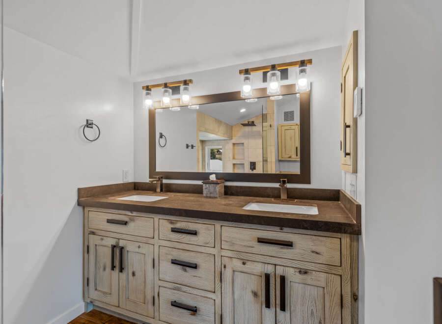 This stunning bathroom boasts a rustic, yet modern design, perfect for a luxurious home.