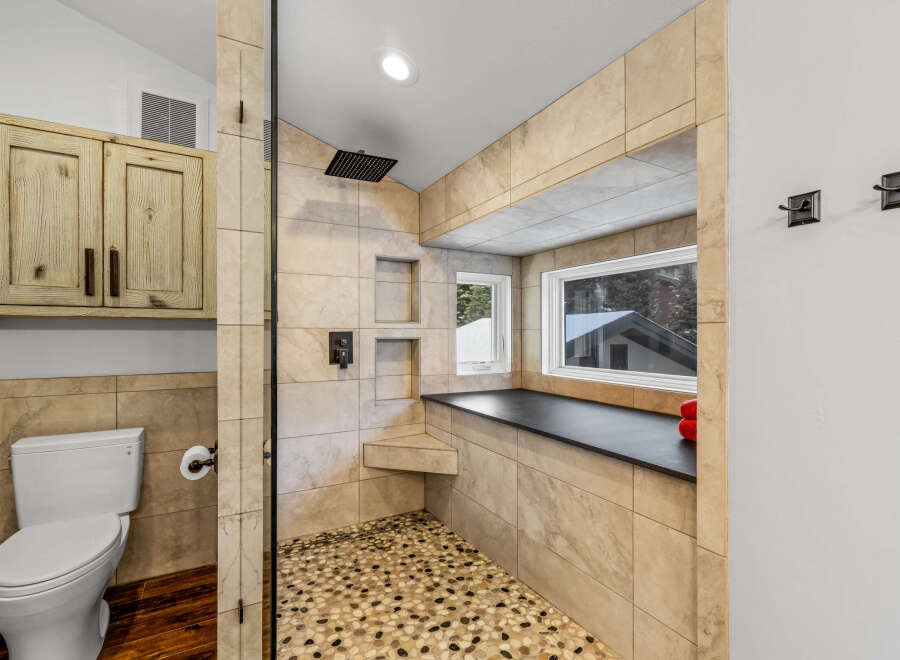 Step into luxury with this stunning bathroom featuring a spacious walk-in shower.