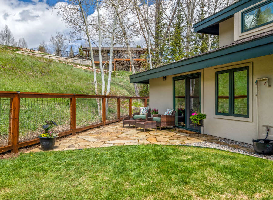 Enjoy the tranquility of this stunning property featuring a beautifully landscaped yard and a charming patio area.