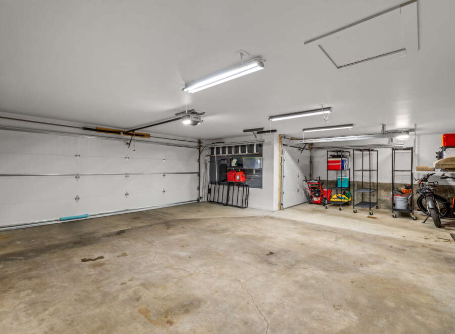 This spacious garage offers ample room for vehicles and storage.
