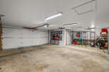 This spacious garage offers ample room for vehicles and storage.