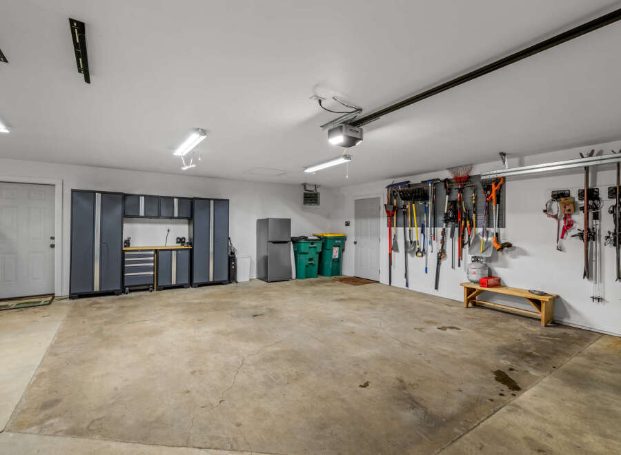This spacious garage offers ample storage and organization solutions.