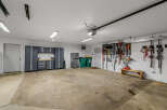 This spacious garage offers ample storage and organization solutions.