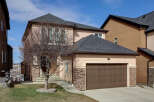 This stunning property boasts a beautiful exterior with a modern design and a well-maintained yard.