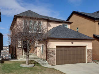 This stunning property boasts a beautiful exterior with a modern design and a well-maintained yard.