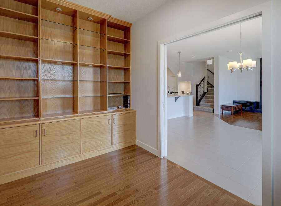This stunning property boasts a custom-built wooden cabinet, perfect for storage and display.