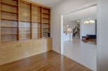 This stunning property boasts a custom-built wooden cabinet, perfect for storage and display.