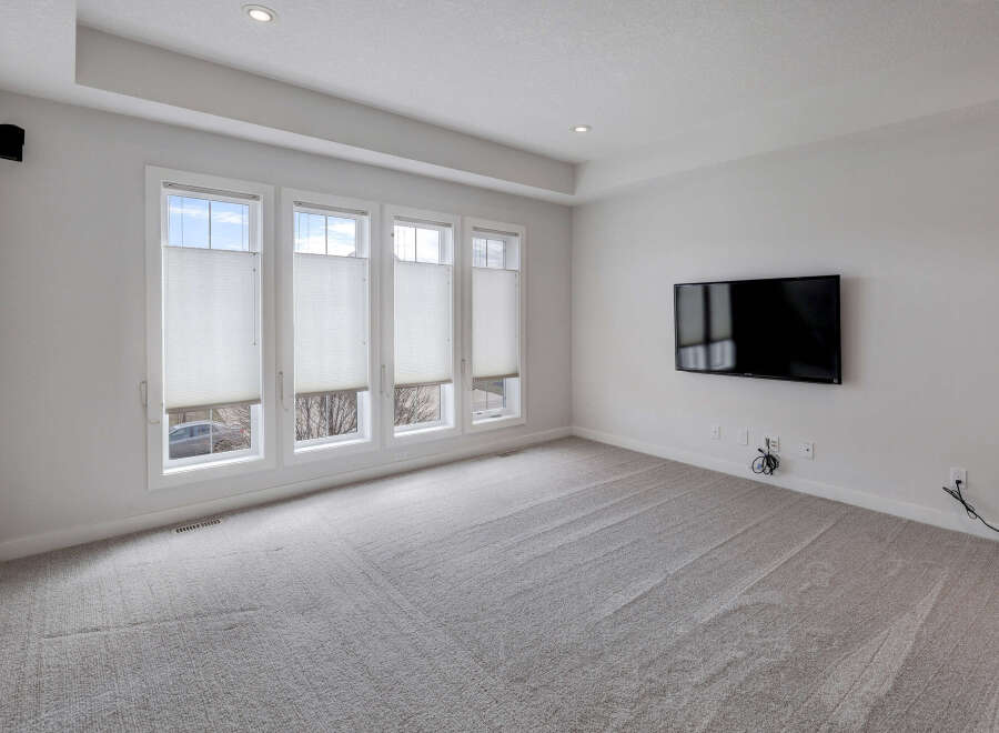 Step into this bright and airy living space, featuring a modern design and neutral color palette.