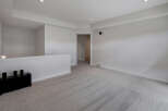 Step into this bright and airy living space, featuring a neutral color palette and plush carpeting.