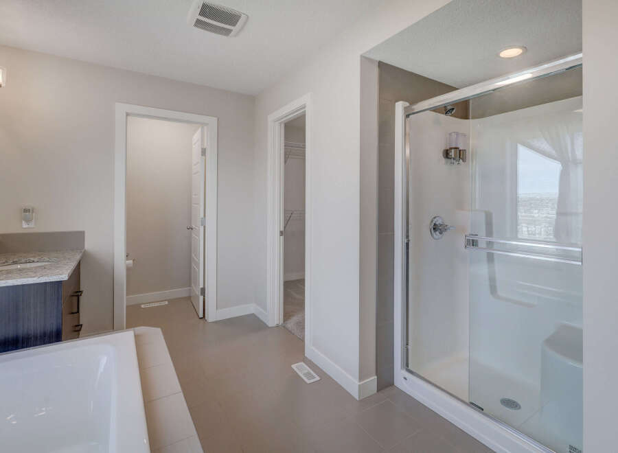 Step into this modern bathroom, featuring a sleek glass shower and contemporary design.