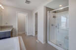 Step into this modern bathroom, featuring a sleek glass shower and contemporary design.