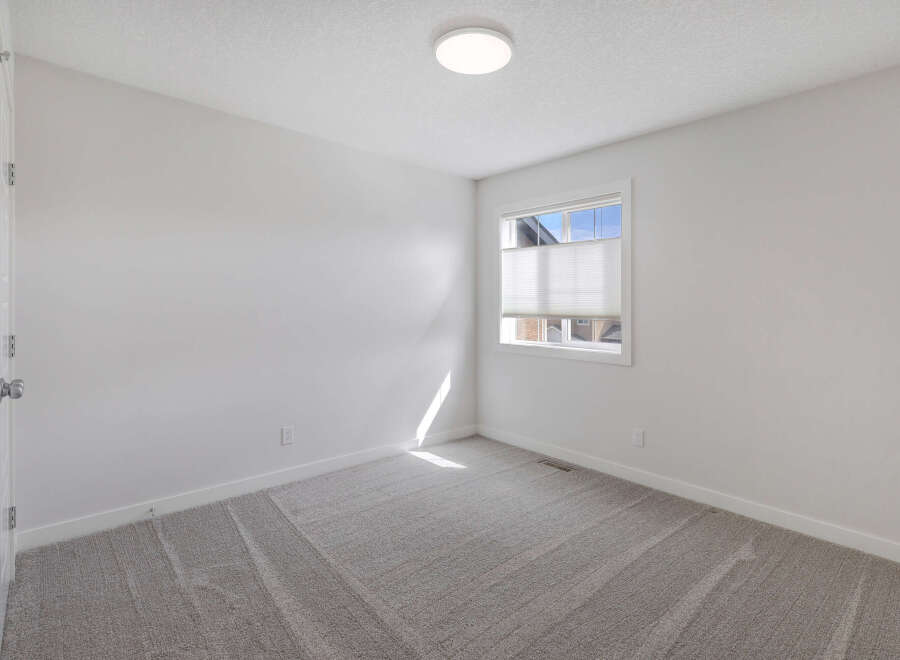 Step into this bright and airy room, perfect for a bedroom or home office.