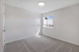 Step into this bright and airy room, perfect for a bedroom or home office.