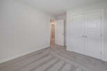 Step into this bright and airy bedroom, featuring a neutral color palette and ample natural light.