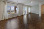 Step into this stunning living space, bathed in natural light and boasting elegant hardwood floors.