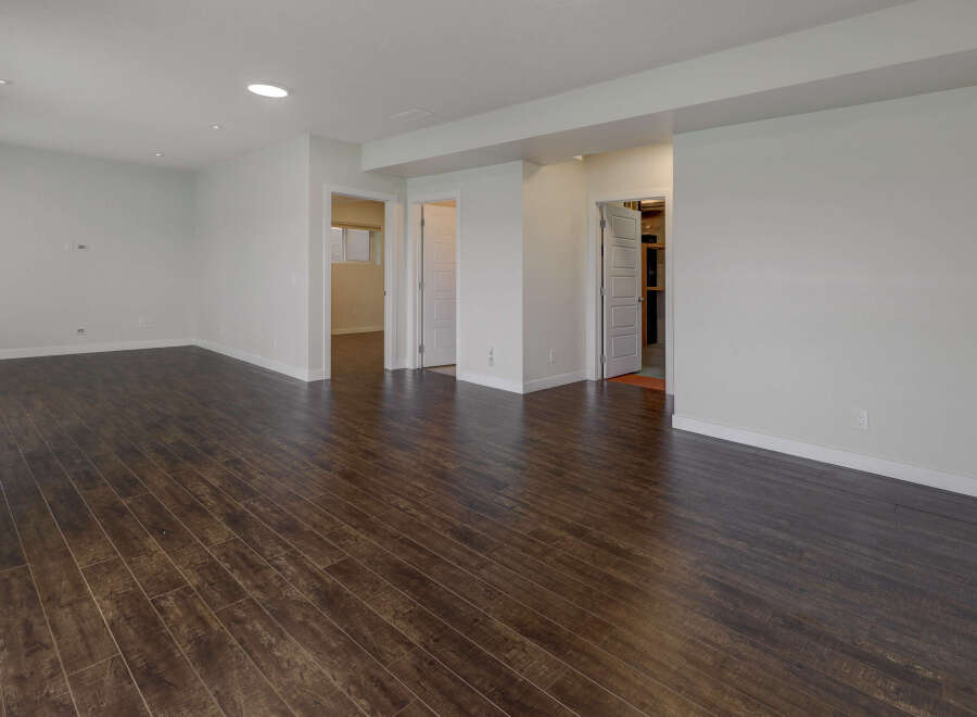 Step into this bright and airy space featuring beautiful dark wood flooring.