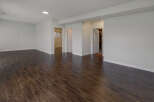 Step into this bright and airy space featuring beautiful dark wood flooring.