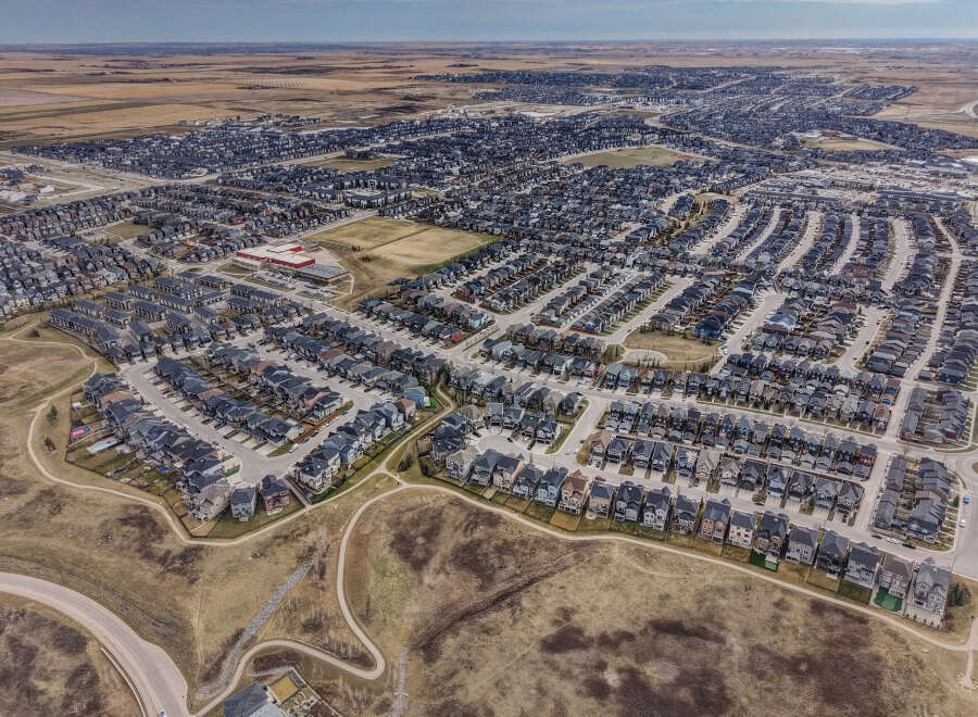Explore this stunning aerial view of a modern residential community, showcasing meticulously designed homes with contemporary architecture.