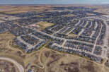 Explore this stunning aerial view of a modern residential community, showcasing meticulously designed homes with contemporary architecture.
