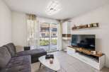 Discover modern living in this stylish property! Featuring a spacious living room with a comfortable sofa and a sleek coffee table, perfect for relaxation.
