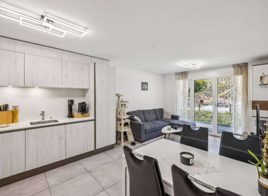 This modern property boasts a stylish open-plan living space, perfect for entertaining.