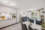 This modern property boasts a stylish open-plan living space, perfect for entertaining.